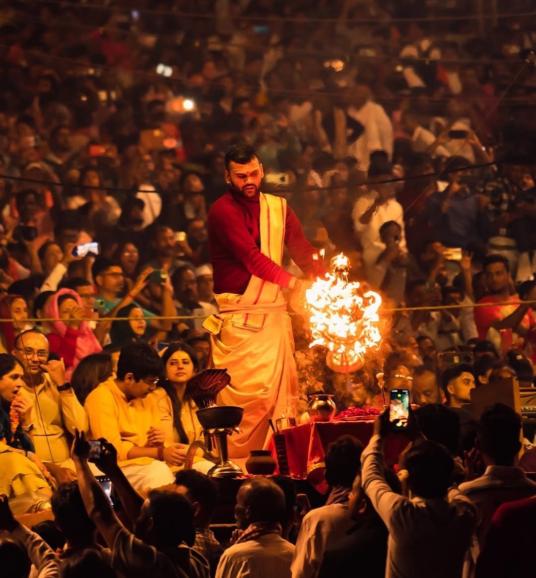 Luxury India Tour guests attending evening Ganga Aarti ceremony